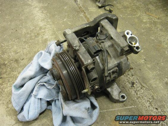 img_1757.jpg Needs this too.... I got a nice JDM compressor I'll sell ya! Lines and wiring don't match up. :(