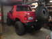 1989 Ford Bronco - This red 1989 Ford Bronco is modified with a lift kit and oversized tires for off-road use.