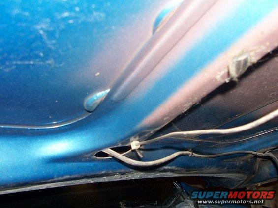 Blue interior panel with pink and white stripes, showing wiring and a SuperMotors logo
