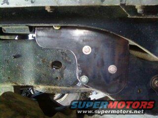 Rear shock hoop mount on vehicle frame. SuperMotors.net logo visible