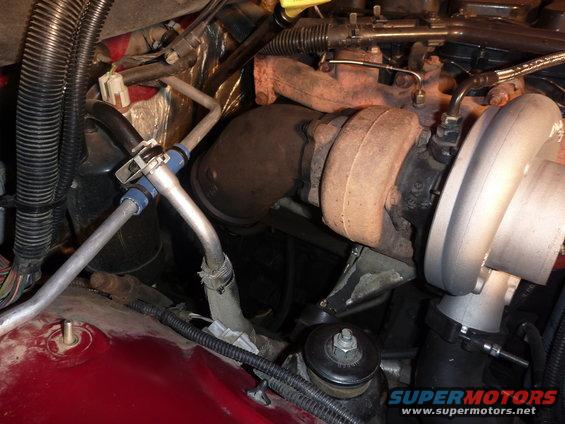 Engine bay showing turbocharger and exhaust manifold