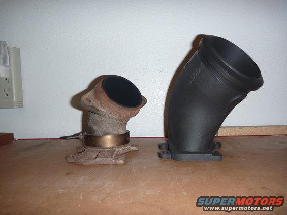 Rusty exhaust pipe with sensor next to a new black exhaust pipe