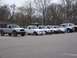 1987 Ford Ranger - A group of Ford Ranger trucks are lined up in a parking lot on an overcast day.