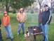 1987 Ford Ranger - A group of friends gather in a park for a barbecue, with food cooking on the grill.