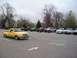 1987 Ford Ranger - A group of Ford Ranger pickup trucks are parked in a lot on a cloudy day.