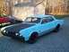 1966 Oldsmobile Cutlass - This sedan has a distinctive body style with quad headlights and a prominent grille.