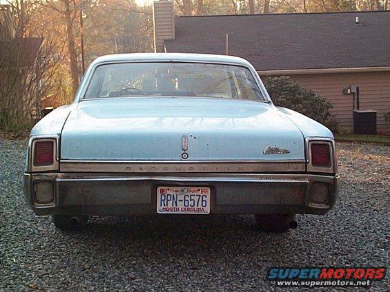 Rear view of a light blue 1965 Oldsmobile Dynamic 88 with a North Carolina license plate