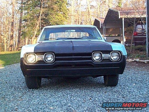 1966 Oldsmobile Cutlass front view, black hood, light blue fenders