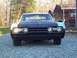 1966 Oldsmobile Cutlass - Front view of a 1966 Oldsmobile Cutlass with a contrasting black hood and light blue fenders.