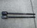 2003 Ford Taurus - Two automotive tie rod ends are shown side-by-side on a concrete surface.