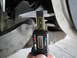 2003 Ford Taurus - A digital caliper is used to measure a component, showing a reading of 26.52 mm.
