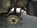 2003 Ford Taurus - Close-up view of a vehicle's rear brake rotor and suspension assembly.