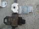 2003 Ford Taurus - A comparison of a new and old car suspension component is shown against a concrete background.