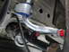 2003 Ford Taurus - Aftermarket suspension parts installed on a vehicle's undercarriage, showing a sway bar and bushings.