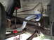 2003 Ford Taurus - This image shows the underside of a vehicle, focusing on the suspension system and exhaust components.