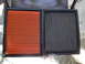 2003 Ford Taurus - Comparison of a new air filter and a used one, showing the difference in cleanliness and color.