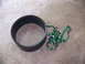 2001 Dodge 1500 - A black ring and green tie-down straps are visible on a concrete surface.