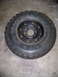 2001 Dodge 1500 - A single tire and wheel assembly is shown against a concrete floor.