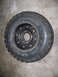 2001 Dodge 1500 - A single Goodyear Wrangler tire mounted on a black wheel is shown, likely for off-road use.