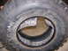 2001 Dodge 1500 - Close-up of a damaged tire beadlock, with 'Goodyear Wrangler' text visible on the sidewall.