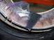 2001 Dodge 1500 - A Ziploc bag filled with ball bearings rests on a worn tire rim, suggesting a repair or modification.