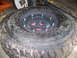 2001 Dodge 1500 - A beadlock wheel assembly is shown, a off-road tire and a reinforced rim with multiple bolts.