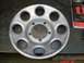2001 Dodge 1500 - A silver wheel cover with a distinctive pattern of ten circular openings is shown, likely a replacement part.