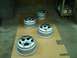 2001 Dodge 1500 - Four silver wheel rims are arranged on a cardboard surface in what appears to be a workshop or garage.