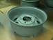 2001 Dodge 1500 - A single gray truck wheel rim is shown up close, with other similar rims blurred in the background.