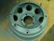 2001 Dodge 1500 - A gray wheel rim is shown close-up, with visible lug nut studs and circular openings.
