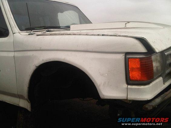 White truck front fender and headlight assembly, likely 1987 model year