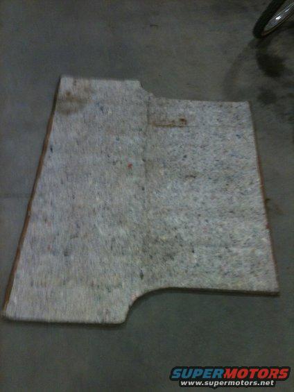 Gray carpet piece with cutouts