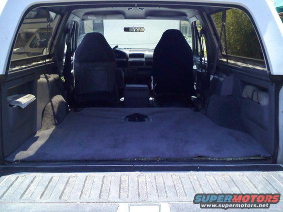 Interior of a 1994 Ford Bronco, rear cargo area and front seats visible