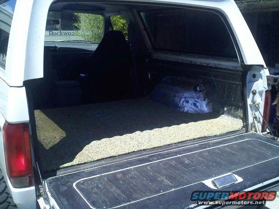 1994 Ford Bronco interior cargo area with carpeted floor and sound deadening material