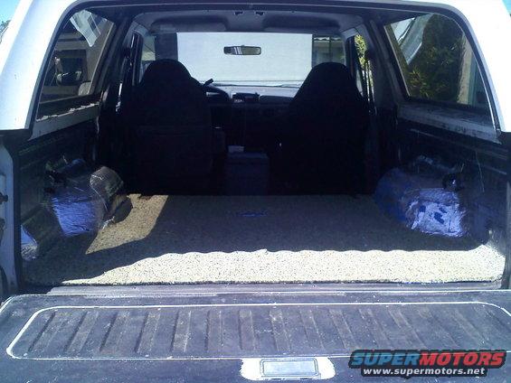 Interior cargo area of a 1994 Ford Bronco, showing seats and carpeted floor