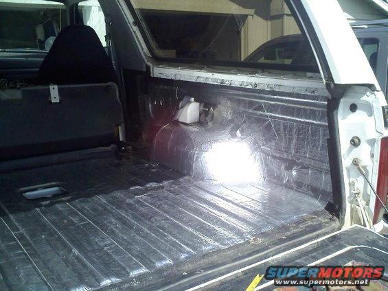 SUV cargo area with sound deadening material on walls and floor