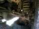 1989 Ford Bronco - Rusted suspension and axle components of a vehicle, possibly undergoing an axle swap.