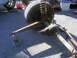 1989 Ford Bronco - Front axle assembly with coil spring and suspension components is shown on jack stands.