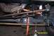 1989 Ford Bronco - Underneath view of a vehicle's front axle and steering system, likely during a repair or modification.