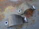 2003 Ford Taurus - These are sway bar brackets. The photo shows them on a rusty surface.