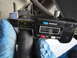 2003 Ford Taurus - A digital caliper is used to measure a dark, cylindrical automotive part.