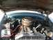 1952 Ford Mainline - Engine bay of a 1952 Ford Mainline, showing the V8 engine, battery, and air cleaner assembly.