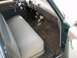 1952 Ford Mainline - Interior view of a vintage car, showing the dashboard, steering wheel, and seating area.