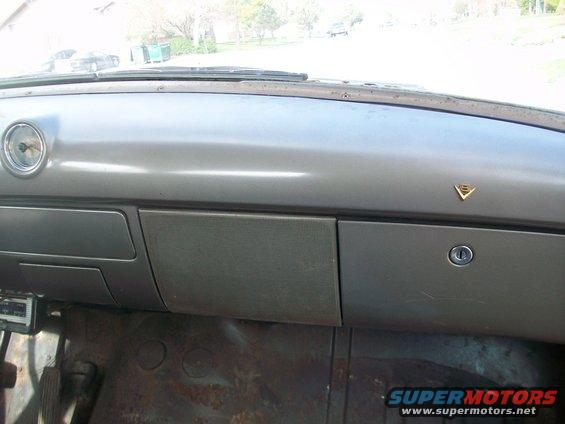 1952 Ford Mainline interior dashboard with round gauge and glove box