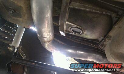 Undercarriage view of exhaust pipes and transmission housing