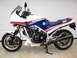 1984 Honda Interceptor - Side view of a 1984 Honda Interceptor 1000 motorcycle parked in front of a garage door.
