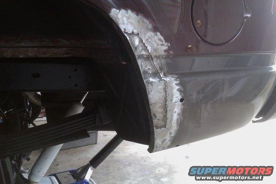 1994 Chevrolet Blazer rear quarter panel with rust repair and welding marks