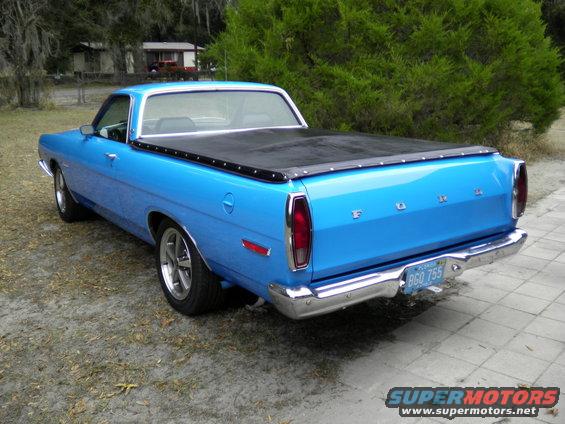 Blue 1969 Ford Ranchero rear view with black tonneau cover and license plate BGO 755