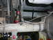 1988 Ford Bronco - Close-up view of the rear axle and suspension components of a vehicle.