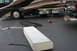 2003 Ford F-350 - An RV's side compartments are open, with a large white tank and other items on the ground.